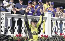  ?? DERIK HAMILTON/ASSOCIATED PRESS ?? Matt Kenseth celebrates in Victory Lane on Sunday after his first career win at Pocono Raceway. It was the fourth win in five races for Joe Gibbs Racing.