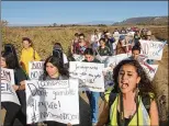  ?? SANDY HUFFAKER / GETTY IMAGES ?? Activists march Wednesday in San Ysidro, Calif., in support of “Dreamers,” immigrants who have lived in the U.S. illegally since they were children.