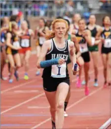  ?? MICHAEL REEVES - FOR DIGITAL FIRST MEDIA ?? Maggie Forbes runs the second leg of Strath Haven’s 4 x 800 relay that took ninth place Friday at Franklin Field.