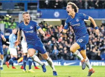  ?? AFP ?? Chelsea's David Luiz (right) celebrates after scoring his side’s second goal against Manchester City at Stamford Bridge on Saturday.