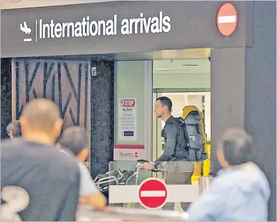  ?? Picture: RNZ ?? Inbound travellers at the Auckland Internatio­nal Airport in New Zealand.