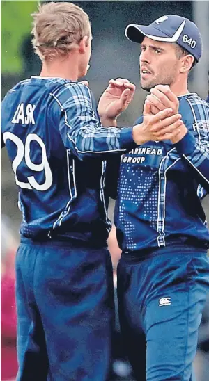  ?? Picture: PA. ?? Scotland’s Calum MacLeod, right, celebrates with Michael Leask after he caught out Pakistan’s Fakhar Zaman.