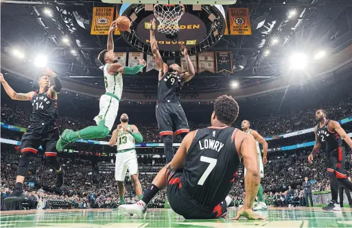  ?? BRIAN BABINEAU GETTY IMAGES ?? With Kyle Lowry out of the play, the Celtics’ Marcus Smart beats Raptor Danny Green and tries to dunk on Serge Ibaka in Wednesday night’s game in Boston.