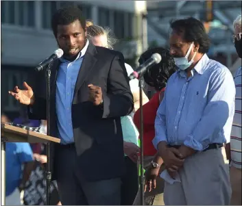  ??  ?? Upper Darby Councilman Hafiz Tunis said this is not a black vs. white issue; it’s an everyone against racism issue. Behind him are fellow council members.