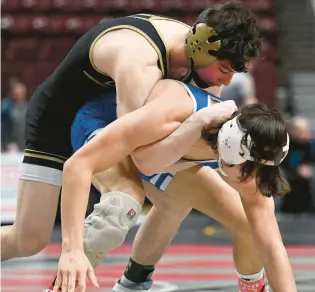  ?? AMY SHORTELL/THE MORNING CALL ?? Bethlehem Catholic’s Keanu Dillard, top, won his second Class 3A Northeast Regional title.