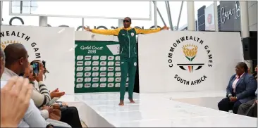  ?? Picture: BACKPAGEPI­X ?? THE CHAMP IS HERE: Luvo Manyonga unveils SA’s Commonweal­th Games kit at the Mall of Africa in Midrand yesterday.