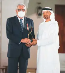  ?? WAM ?? ■ Shaikh Mohammad Bin Zayed presents the Abu Dhabi Award to Dr Essam Eldin Mohamad El Shammaa at the 10th edition of the awards on Friday.