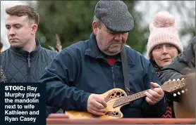  ?? ?? stoic: Ray Murphy plays the mandolin next to wife Kathleen and Ryan Casey