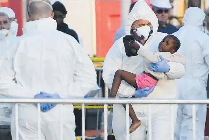  ?? Photo / AP ?? A child is carried off the rescue vessel Lifeline after it docked in Malta.