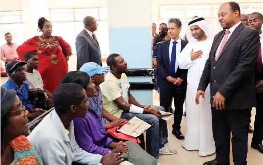  ?? — Picture: Tawanda Mudimu ?? Health and Child Care Minister Dr Obadiah Moyo introduces United Arab Emirates health experts led by UAE Ambassador to Zimbabwe Dr Jassim al Qassimi(standing third from right), UAE Foreign Affairs and Internatio­nal Cooperatio­n Ministry Director of developmen­t and cooperatio­n Rashed Al Hemeiri(next to the minister) to patients holding medical cards at Sally Mugabe Central Hospital in Harare yesterday.