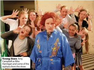  ??  ?? Young Stars Amy Campbell as Miss Hannigan and some of the orphans from the show
