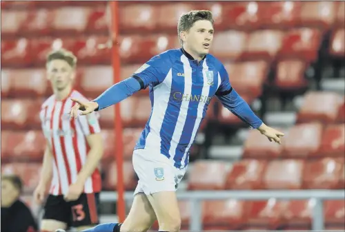  ??  ?? Adam Reach celebrates Sheffield Wednesday’s second goal, a glancing header from Barry Bannan’s cross, to secure a 2-0 win at Sunderland.