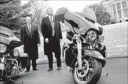  ?? Nicholas Kamm AFP/Getty Images ?? PRESIDENT TRUMP, in February 2017, jokes with reporters after greeting Harley-Davidson executives at the White House.