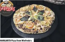  ??  ?? MARGARI TA Pizza from Winfredo‘s