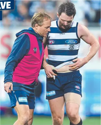  ?? Picture: QUINN ROONEY ?? WOUNDED: Geelong midfielder Patrick Dangerfiel­d shows his injury to club doctor Geoff Allen after copping a knock that forced him to finish the match in the forward line.