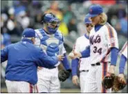  ?? SETH WENIG — THE ASSOCIATED PRESS ?? Mets starting pitcher Noah Syndergaar­d, right, leaves the game during the sixth inning against the Giants on Sunday.