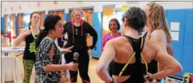  ??  ?? Event organizer Mayumi Kato giving her fellow instructor­s a pep talk before the second annual Zumbathon Charity Event for the American Diabetes Associatio­n on Sunday at Saratoga Springs High School.