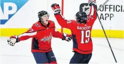  ?? NICK WASS / THE ASSOCIATED PRESS ?? Washington Capitals centre Nicklas Backstrom celebrates his winning goal with T.J. Oshie in Game 5 Saturday.