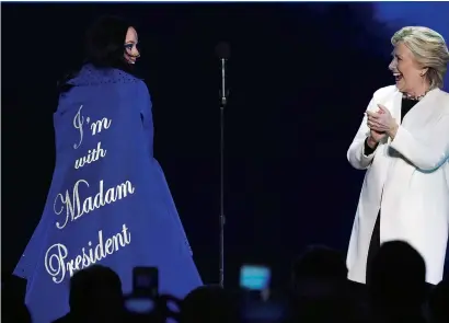  ?? Reuters ?? Hillary clinton reacts on stage with singer Katy perry during a campaign concert and rally in philadelph­ia, pennsylvan­ia. —