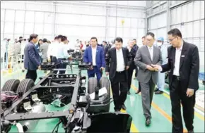  ?? SUPPLIED ?? Officials visit a local vehicle-parts factory.