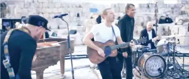  ??  ?? Coldplay launched its newest album with only two gigs in Amman, Jordan to cut down on carbon footprint (YouTube clip)