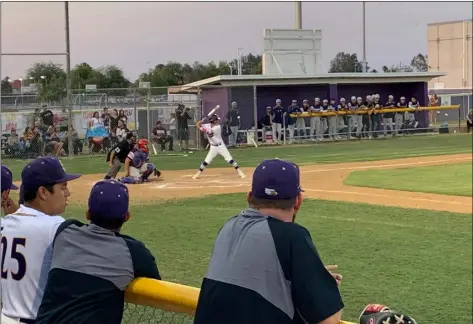  ?? PHOTO RYAN RIGNEY ?? Southwest eagles coach Matt Redden and eagles players watch as Danny Ramirez steps up to bat.