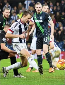  ??  ?? COOL FINISH: Jonny Evans slots home Albion’s late winner