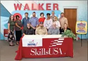  ?? Georgia Northweste­rn Technical College ?? Garrett Rollins (seated, second from left) is surrounded by those who attended his SkillsUSA National Signing Day ceremony, May 5, at GNTC’s Walker County Campus. Also pictured (from left, seated) are his father, Donny Rollins; Mark Collins, Metro Boiler Tube; and Teresa Phillips, Metro Boiler Tube; (from left, standing) Julie Portwood, coordinato­r of Secondary Instructio­n and Walker LAUNCH, Walker County Schools; Deidrienne Gross, Walker LAUNCH instructor; Tayler Davidson, instructor of Welding and Joining Technology, GNTC; Jeremiah Cooper, program director and instructor of Welding and Joining Technology, GNTC; Sarah Jenkins, SkillsUSA advisor; Lugenia Suttles, assistant principal, LaFayette High School; Damon Raines, superinten­dent, Walker County Schools; Maggie Stultz, principal, LaFayette High School; and Justin Carruth, coordinato­r of Secondary Curriculum and Career, Technical and Agricultur­al Education, Walker County Schools.