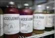  ??  ?? Cold pressed juice pressed by Mendez Fuel is displayed at the Mendez Fuel convenienc­e store in Miami.