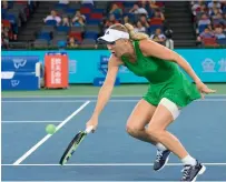  ?? AFP ?? Wozniacki hits a return against Samantha Stosur. —