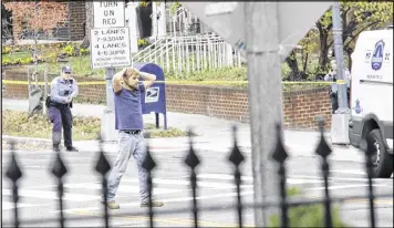  ?? SATHI SOMA / VIA ASSOCIATED PRESS ?? Edgar Maddison Welch, 28, of Salisbury, N.C., surrenders to police Sunday in Washington, D.C. Police say Welch fired a rifle inside a D.C. pizza restaurant he believed was linked to a child sex-traffickin­g ring. No one was hurt.