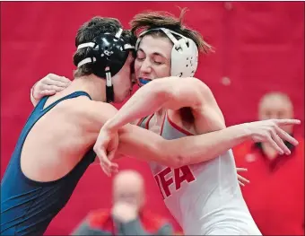  ?? SARAH GORDON/THE DAY ?? NFA’s Dominic Renfree, right, and Ledyard’s Micah White wrestle for control during their 132-pound match on Wednesday night at NFA. Renfree recorded a pin in 1:39, but Ledyard won the match 43-33.