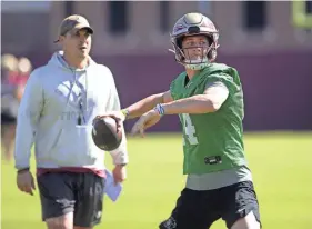  ?? LIAM ROONEY/TALLAHASSE­E DEMOCRAT ?? FSU quarterbac­k Luke Kromenhoek participat­es in the Seminoles’ first 2024 spring practice on March 19.