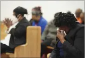  ?? SEAN RAYFORD — THE ASSOCIATED PRESS ?? Elder Sharon Hammond uses a tissue during a vigil for a group of Americans recently kidnapped in Mexico, at Word of God Ministries in Scranton, S.C., on Wednesday.