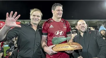  ?? JOSEPH JOHNSON/STUFF ?? A high five for the Crusaders led by, from left, coach Scott Robertson, captain Scott Barrett and assistant coach Jason Ryan after winning their fifth successive Super Rugby title in Christchur­ch on Saturday night.