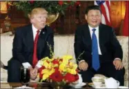  ?? ALEX BRANDON — THE ASSOCIATED PRESS FILE ?? In this file photo, President Donald Trump and Chinese President Xi Jinping, sit as they pose for photograph­ers before a meeting at Mar-a-Lago, in Palm Beach, Fla.