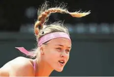  ?? AP ?? High bounce Slovakia’s Anna Schmiedlov­a serves to Belgium’s Alison van Uytvanck at the Roland Garros yesterday.