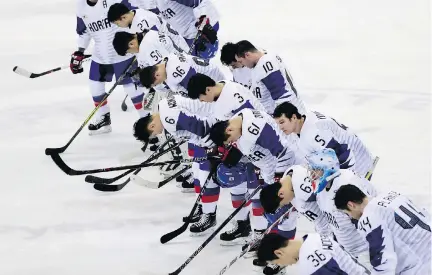  ?? PHOTOS: MATT SLOCUM/THE ASSOCIATED PRESS ?? Players from South Korea bow after the preliminar­y round of the men’s hockey game against Canada at the 2018 Winter Olympics in Gangneung, South Korea on Sunday. Canada defeated South Korea 4-0 to close out group play.