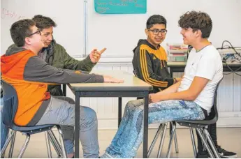  ?? | ?? ABOVE: Freshmen at Alcott College Prep act a scene from TimeLine theater’s production of “Boy” last month. LEFT: TimeLine teaching artist Lexi Saunders with freshman Auriel Williams.