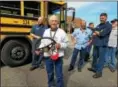  ?? DAN SOKIL — DIGITAL FIRST MEDIA ?? North Penn School District bus driver Jim Allebach holds the steering wheel from his longtime Bus 124 after it was removed and presented by district transporta­tion staff as a reminder of his 51-year career driving for the district.