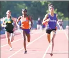  ?? Arnold Gold / Hearst Connecticu­t Media ?? Danbury’s Alanna Smith, right, wins the 400-meter dash at the State Open on Monday.