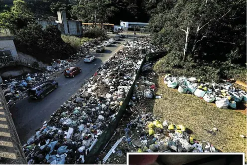  ?? Picture: Sandile Ndlovu ?? A steady stream of residents dumped their rubbish on the road of a closed refuse site in Durban as a strike by municipal workers continued.