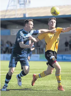  ?? Picture: SNS. ?? Jim Lister battling with Annan’s David McKenna.
