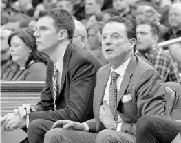  ?? TIMOTHY D. EASLEY/ASSOCIATED PRESS ?? Louisville coach Rick Pitino, right, watches with assistant coach David Padgett during the team’s game last year against Virginia. Padgett was named interim coach Friday.