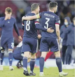  ??  ?? 0 Callum Mcgregor and Andy Robertson walk off at the end