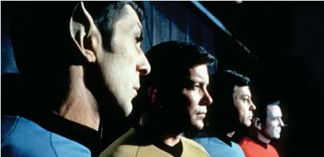  ?? AP FILE ?? TREKKING: William Shatner, second from left as Capt. James T. Kirk, with, from left, Leonard Nimoy as Mr. Spock, DeForest Kelley as Dr. McCoy and James Doohan as Scotty from ‘Star Trek,’ will blast off on a Blue Origin rocket, as seen below. At top, the ‘Star Trek’ spaceship, USS Enterprise.