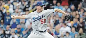  ?? JEFF ROBERSON
THE ASSOCIATED PRESS ?? Los Angeles Dodgers relief pitcher Ryan Madson throws during the sixth inning of Game 7 of the National League Championsh­ip Series against the Brewers on Saturday in Milwaukee.