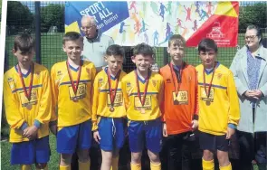  ?? ?? In the medals Hamilton’s St John the Baptist Primary were joint-third in the boys’event