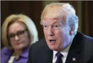  ?? SUSAN WALSH - THE ASSOCIATED PRESS ?? President Donald Trump, right, sitting next to Sen. Claire McCaskill, D-Mo., left, speaks during a meeting with members of the Senate Finance Committee and members of the President’s economic team in the Cabinet Room of the White House in Washington,...