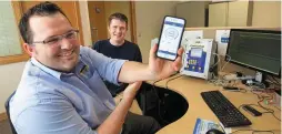  ??  ?? Dairymaste­r staff members Denis Murphy and Christophe­r O’Donovan testing software at the company’s Kerry offices
